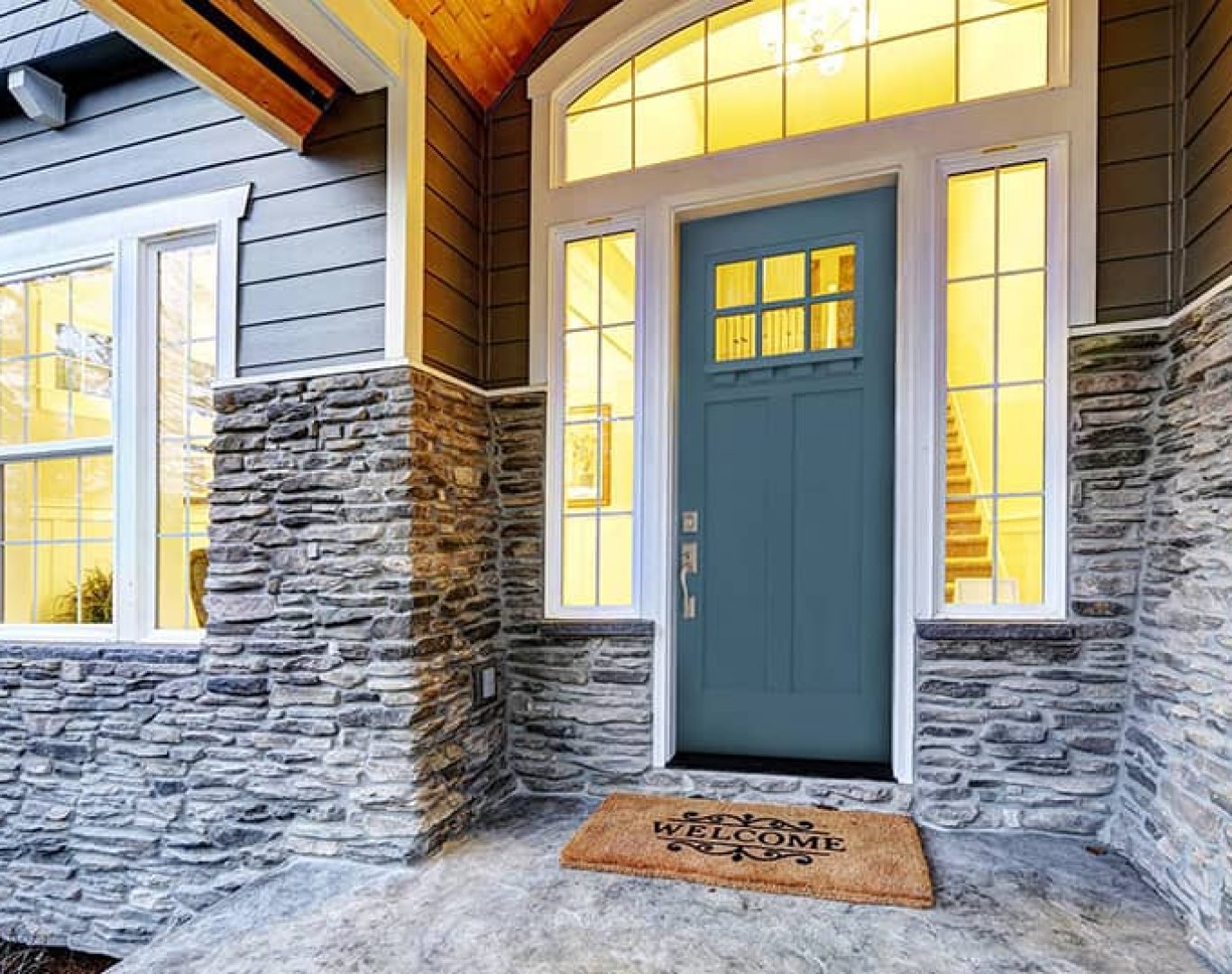 Installer measuring and fitting a new entry door on a Three Rivers, MI family home