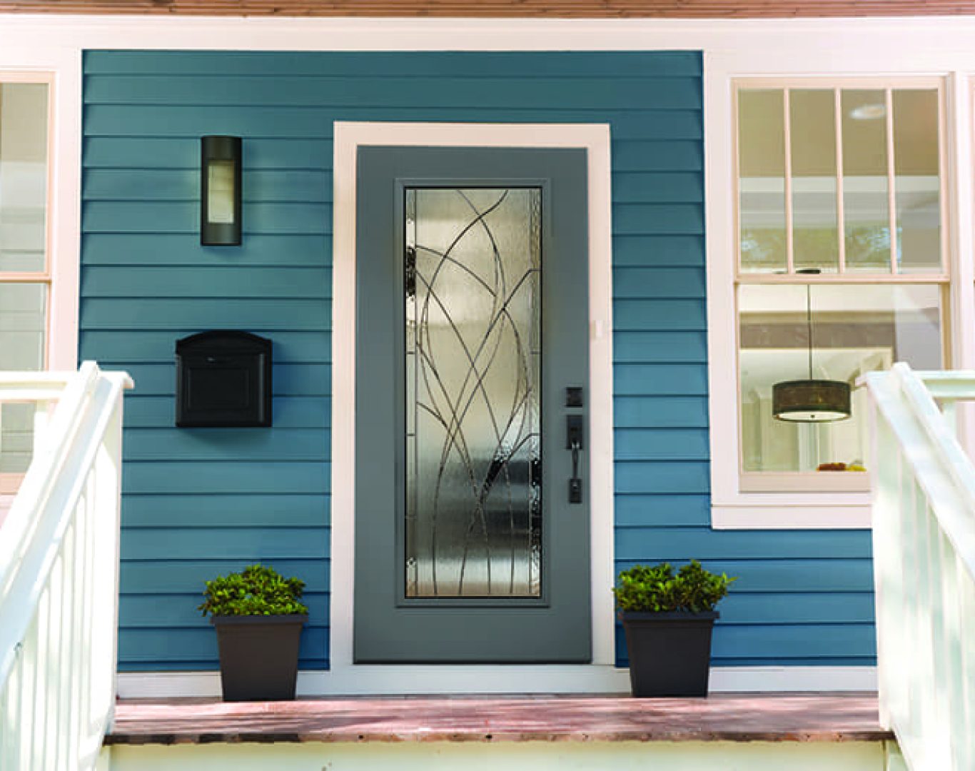 Technician installing a secure new front door at a South Haven, MI lakeside cottage