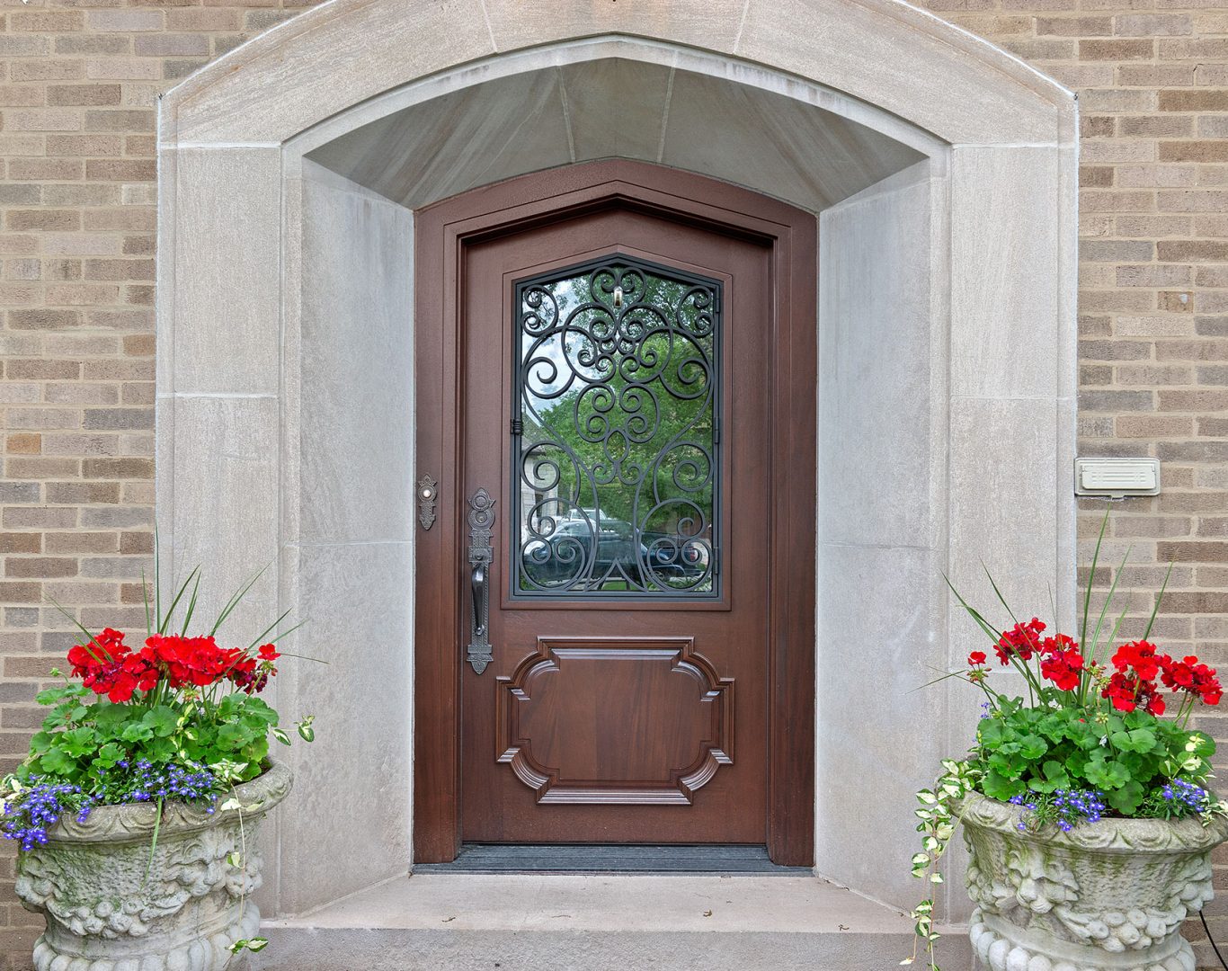 Experienced technician from ADoorable Kalamazoo precisely installing a high-quality, durable front door in a Texas Township home