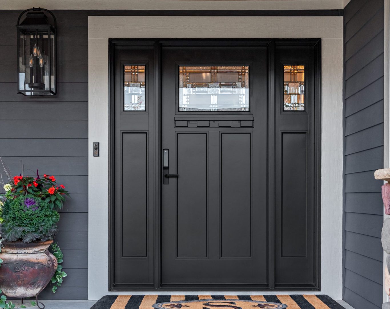 Stylish and secure front door installed by ADoorable Kalamazoo enhancing a home in Oshtemo