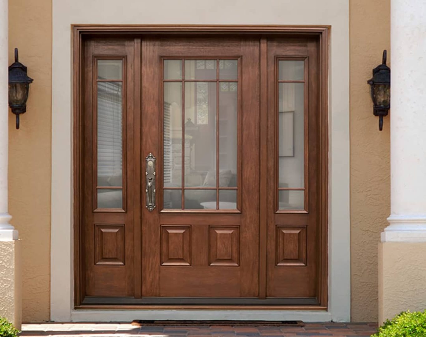 Installer aligning new entry door on a suburban Plainwell, MI home during a scheduled replacement
