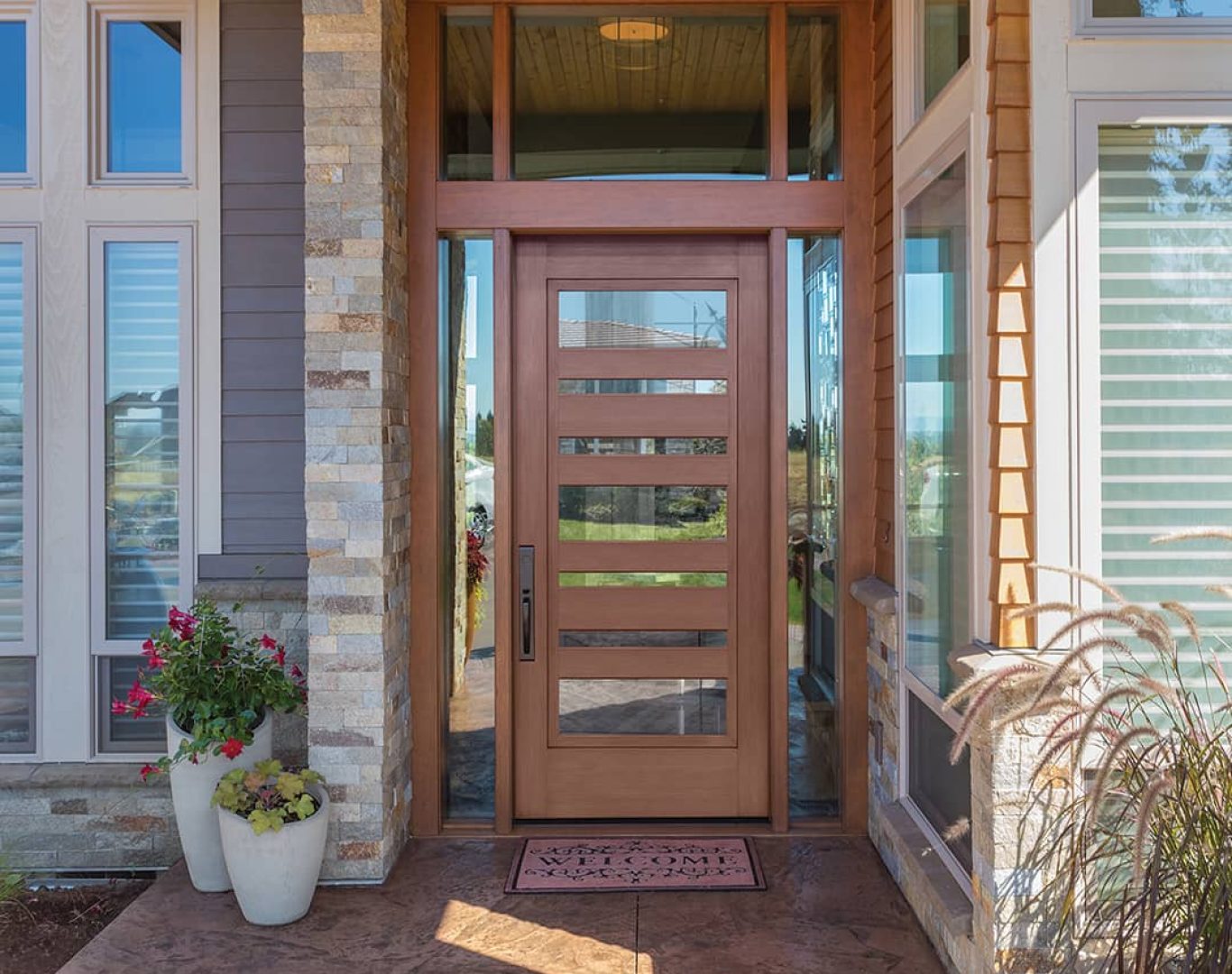 Expert installer using specialized tools to secure a new front door in a Schoolcraft, MI home